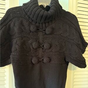 Beautiful Bebe sweater with covered button detail on front. Size medium.